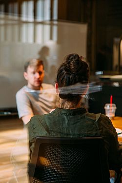 Two people in a meeting