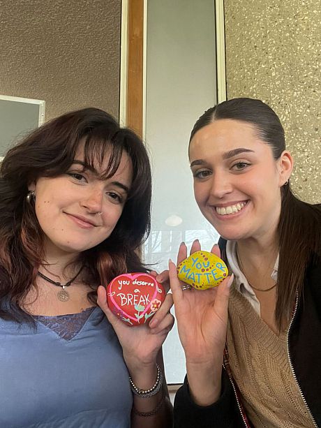placement students (Freya and Ray) with rocks from Rock Painting event