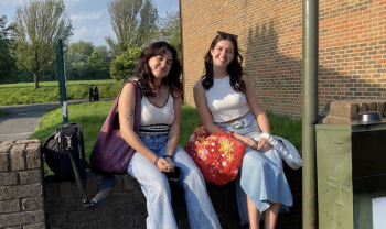 freya and ray sat on a wall
