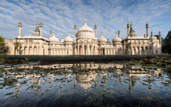 The Pavilion taken from a low angle during the day. The bottom of the image is the reflection of the pavilion in the water of the pond in its garden.