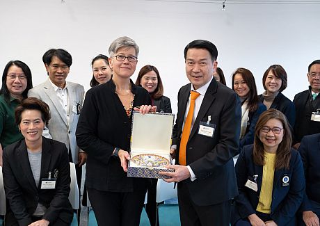 Zhejiang Gongshang University and Sussex colleagues group photo around a table