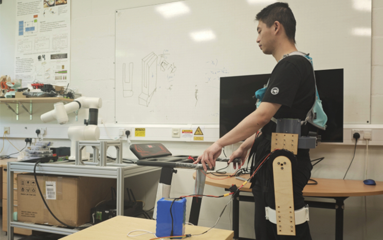 A student using assistive and rehabilitation robotics