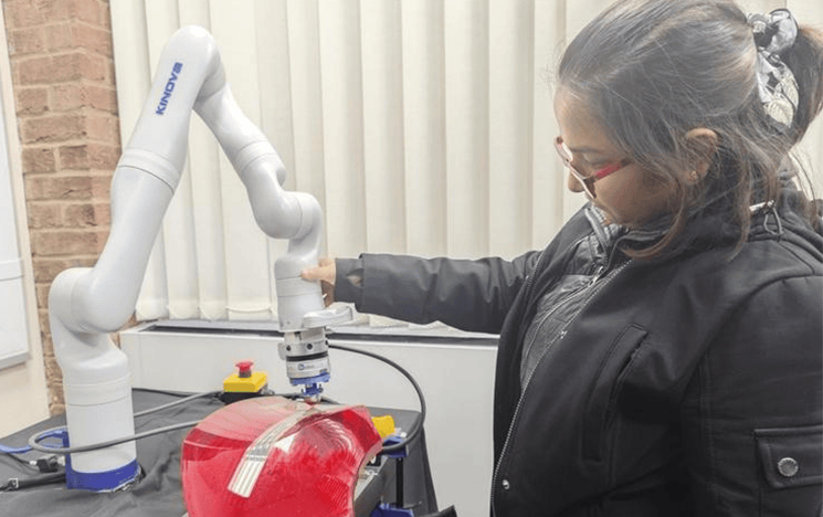 A student using equipment in the Robotics lab