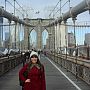 Student smiling on Brooklyn Bridge