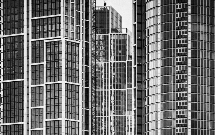 A modern high-rise in London photographed in black and white.