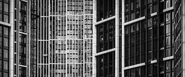 A modern high-rise in London photographed in black and white.