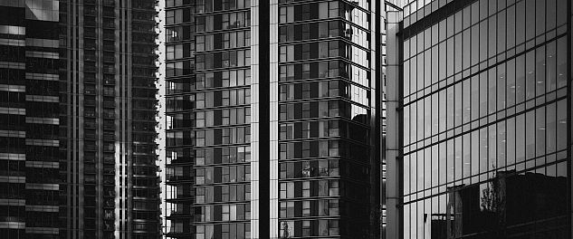 A modern high-rise in London photographed in black and white.