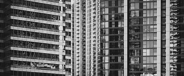 A modern high-rise in London photographed in black and white.