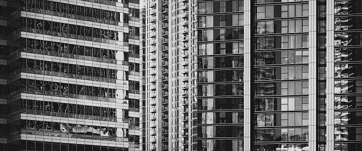 A modern high-rise in London photographed in black and white.