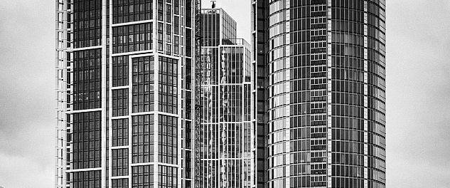 A modern high-rise in London photographed in black and white.