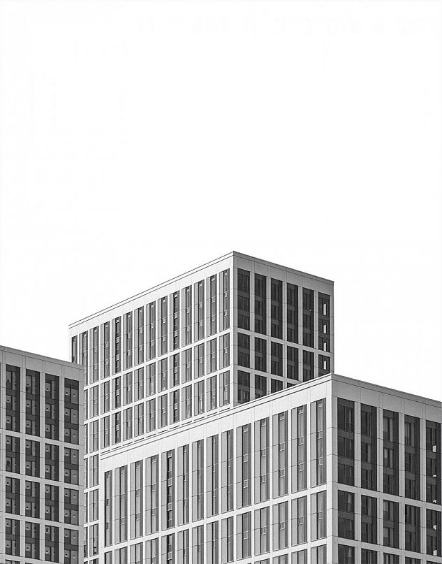 A modern high-rise in London photographed in black and white.