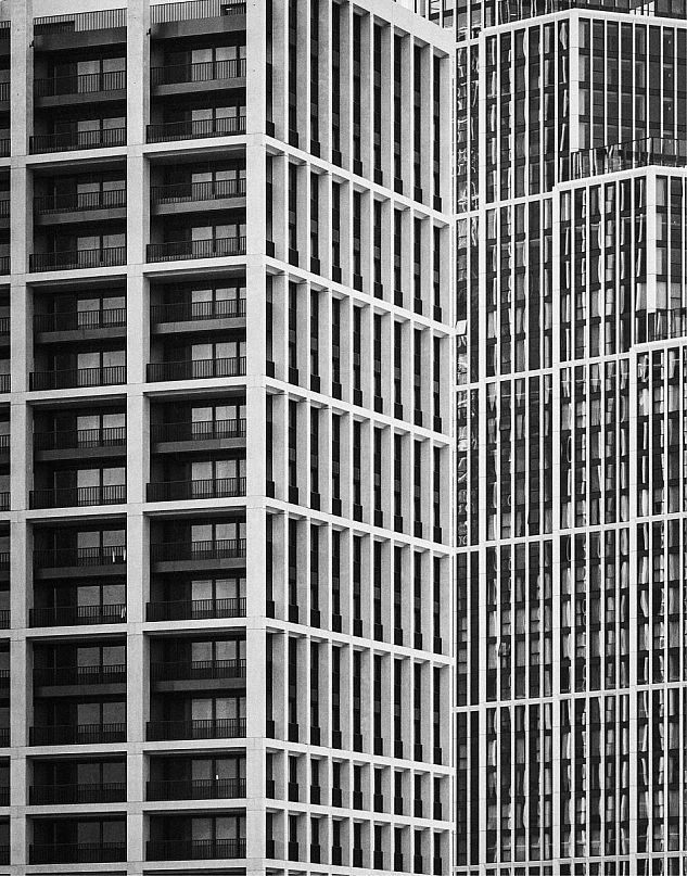 A modern high-rise in London photographed in black and white.