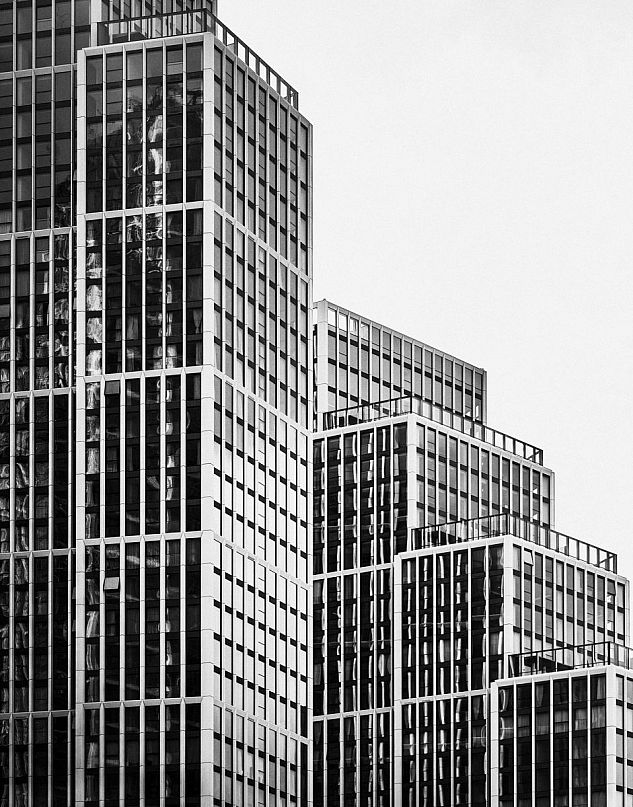 A modern high-rise in London photographed in black and white.