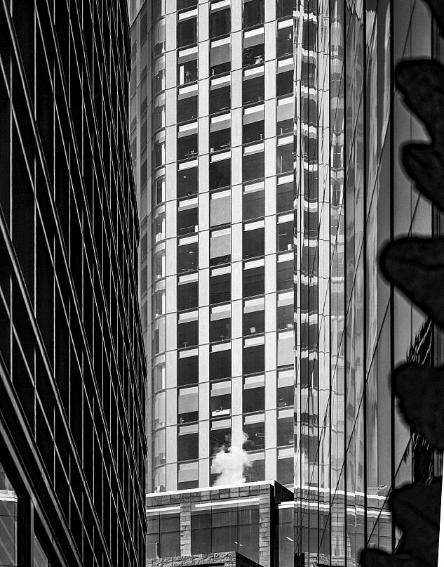 A modern high-rise in London photographed in black and white.