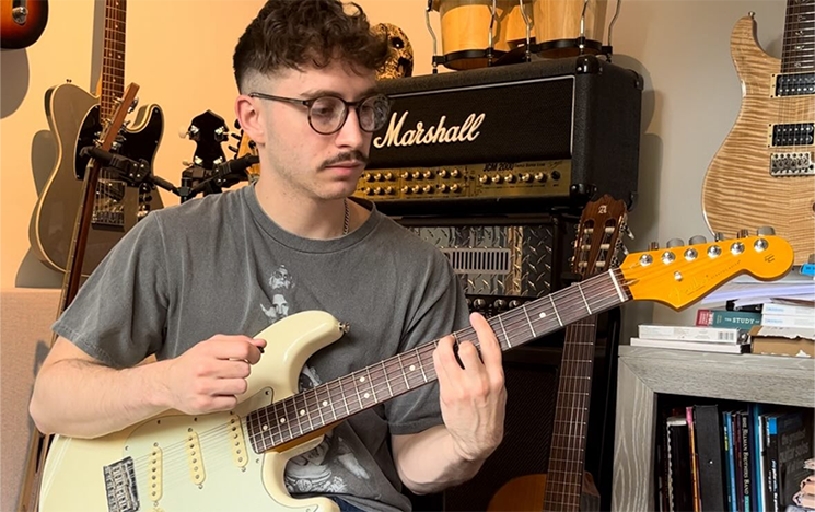 A man playing an electric guitar