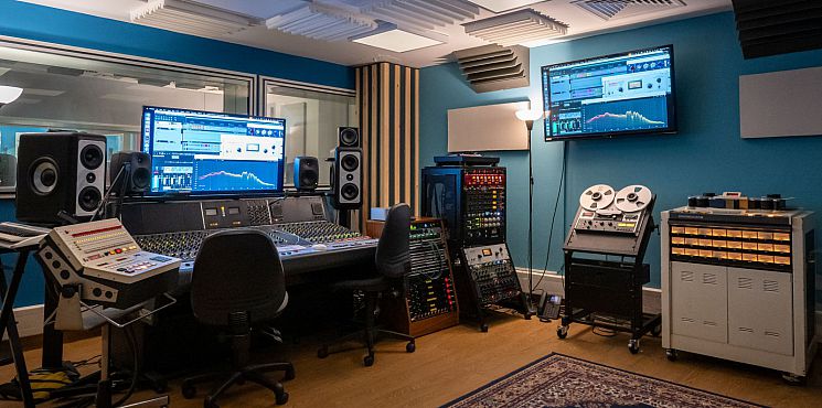 The control room of Music Studio 1, including mixing desk, outboard, and tape machines.