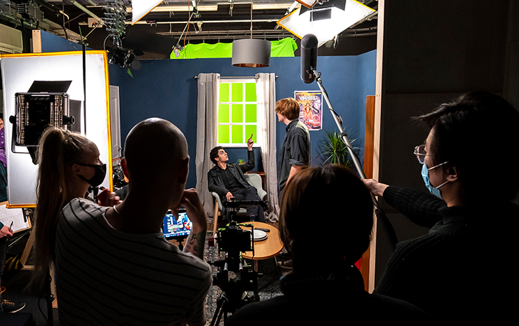 Students working on a film set.