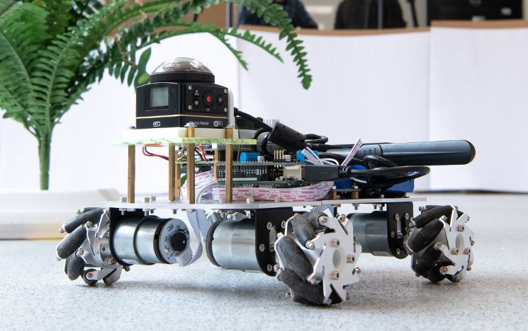 Wheeled indoor autonomous robot with omnidirectional wheels.
