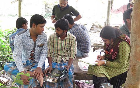 Two farmers being interviewed about their knowledge of pollinators on a farm on the outskirts of Kolkata