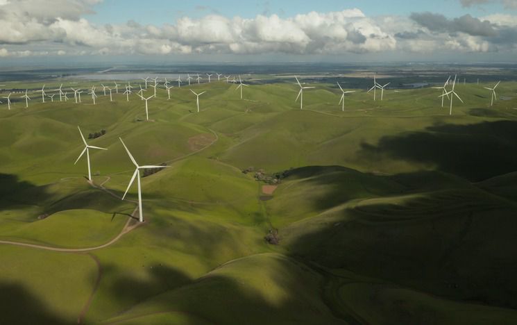 Aerial view of wind turbines - Photo by Tyler Casey on Unsplash
