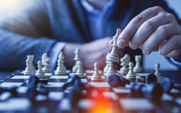 View of a chessboard with man making move