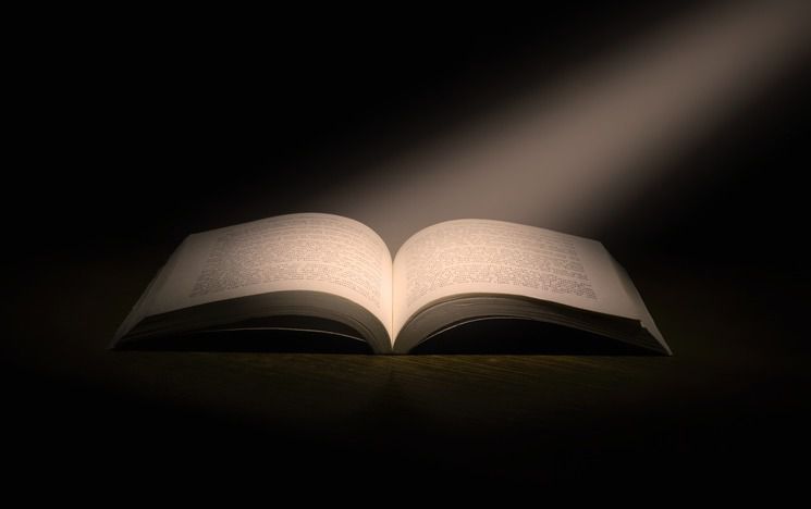 Open book with spotlight on it