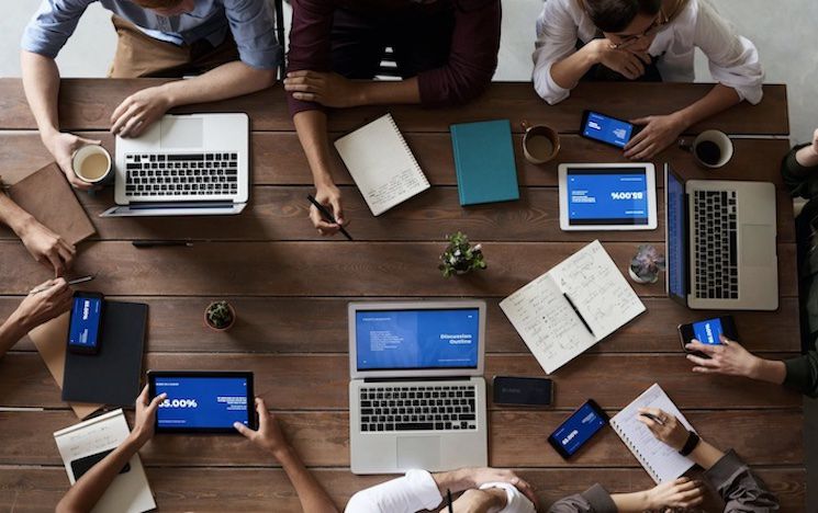 People sitting around a desk