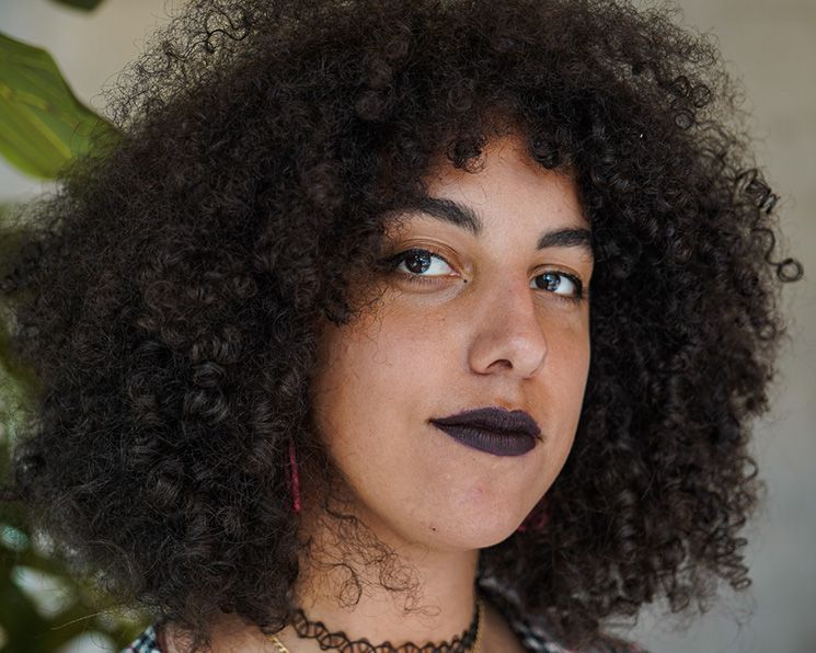 Photo of Erin James, a Black female presenting person.