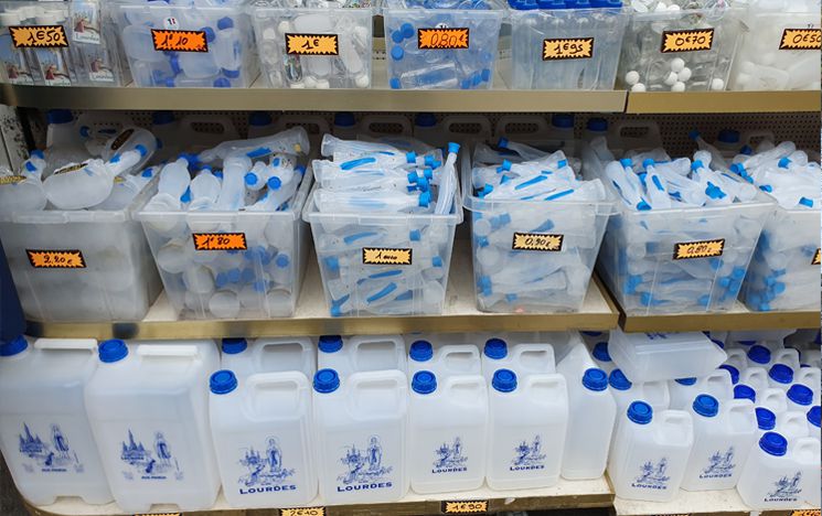 Bottles for sale in a Lourdes souvenir shop