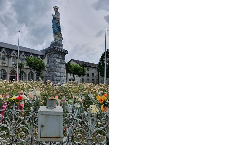 collection box by the statue of Our Lady crowned