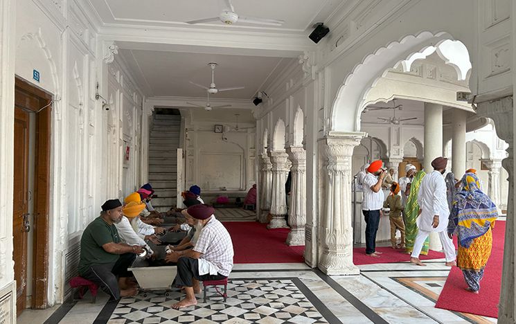 Cleaning bowls at the Golden Temple