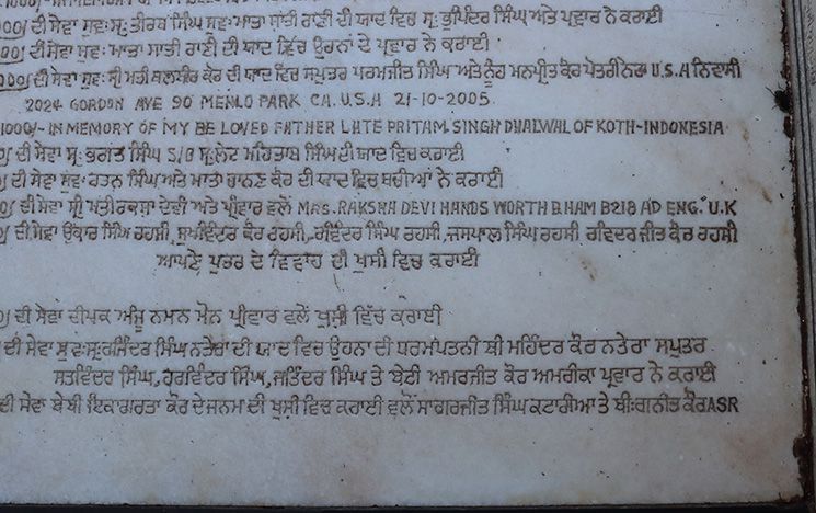 Votive messages in Gurmukhi and Roman scripts, one of which is from a donor in Birmingham