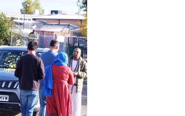 A Hindu priest performing a seva/service for Blessing a New Car purchased by Visitors at Birmingham Temple