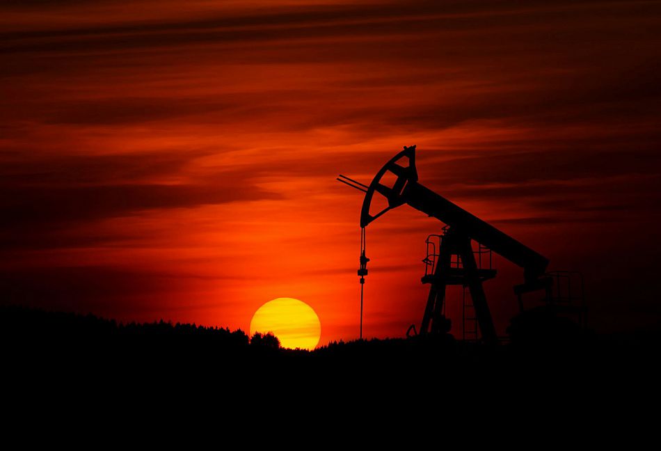 us oil rig with sunset