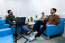 researcher talking to two participants