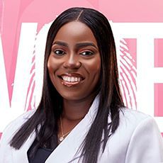 Headshot of a smiling woman against a pink background