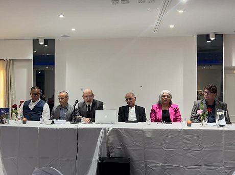 Prof. Magnus Marsden sat at a table as part of a Panel