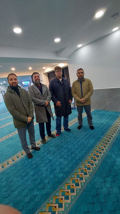 Prof. Magnus Marsden posing for a photo with members of the Afghan Islamic Cultural Centre in Neasden, London