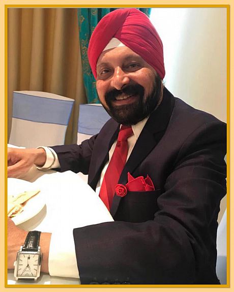 Dr. Tej Khurana, smiling, posing for a photograph