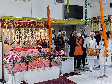 Musicians entering Guru Nanak Society of London Trust Gurdwara for the birthday celebrations