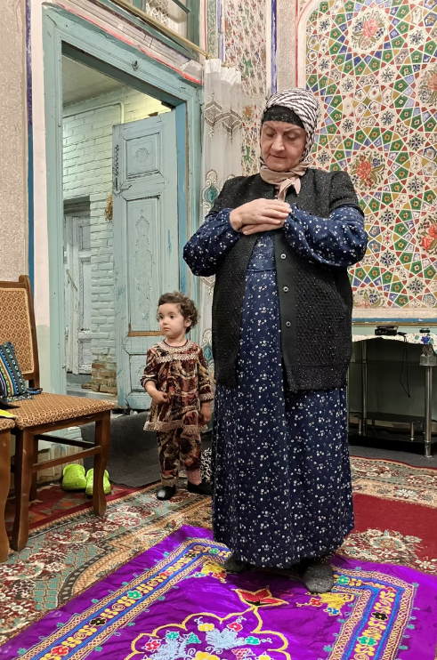 Muslim woman in Bukhara praying