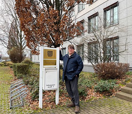 Magnus stood beside the sign for the Leipzig State Archives - 2 Dec. '24