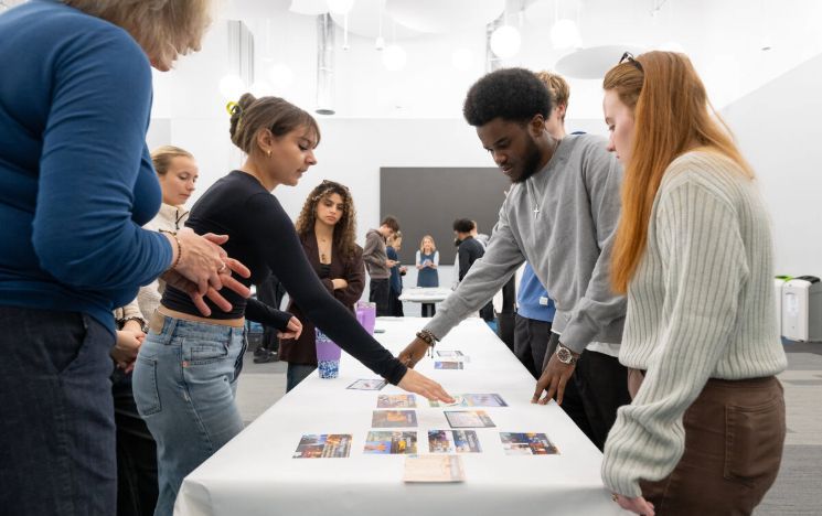 Students participate in a Climate Fresk workshop