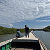 People on a boat looking out into the water