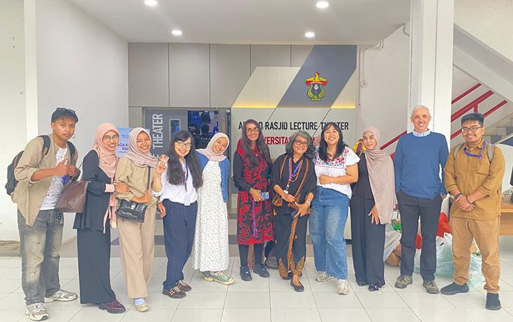 Group of people standing in a row