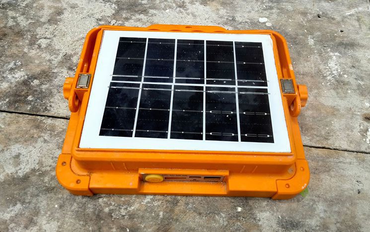 Small solar panel with orange case