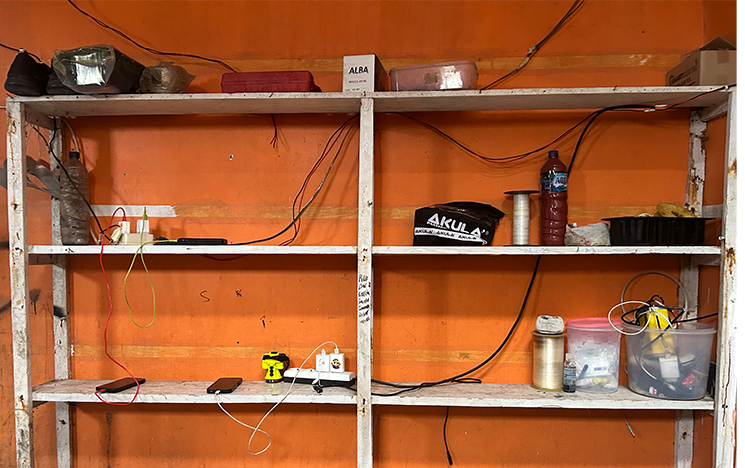 Wire set up behind the shelves of Biyowasa local store.