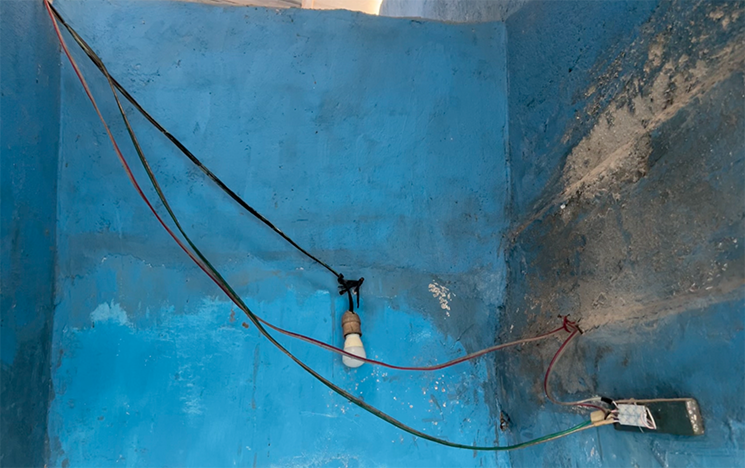 A display of wires to illuminate a Rannu bathroom in Sulawesi.