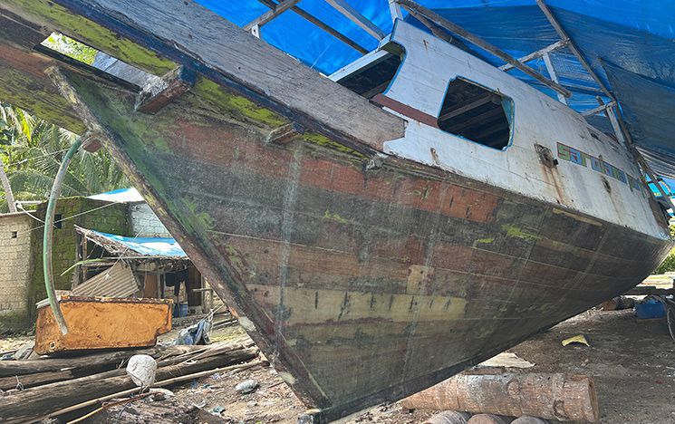Close up of boat on land waiting for repair