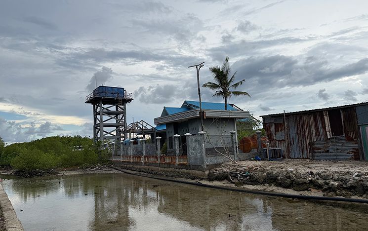 Industrial building next to a shallow river